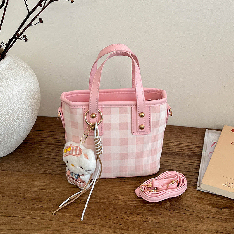mini handbag with checkered design and playful pendant