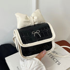 Women’s mini handbag with playful bow detail