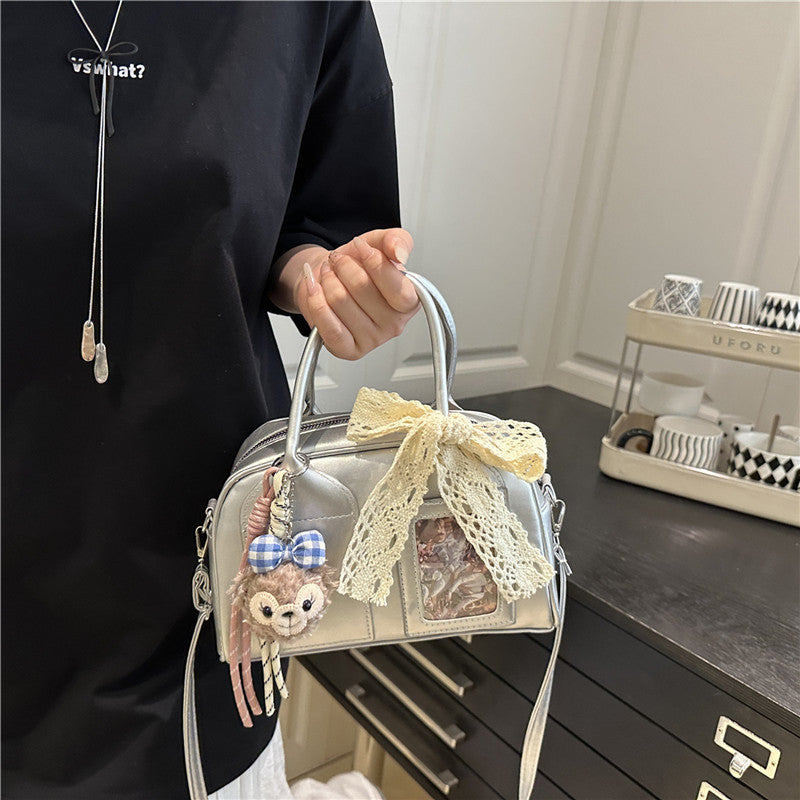 mini handbag with playful animal design and charming pendant