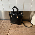 Women’s mini handbag with elegant carrying handle and practical inner compartment