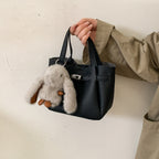 Ladies mini handbag with playful design and animal pendant