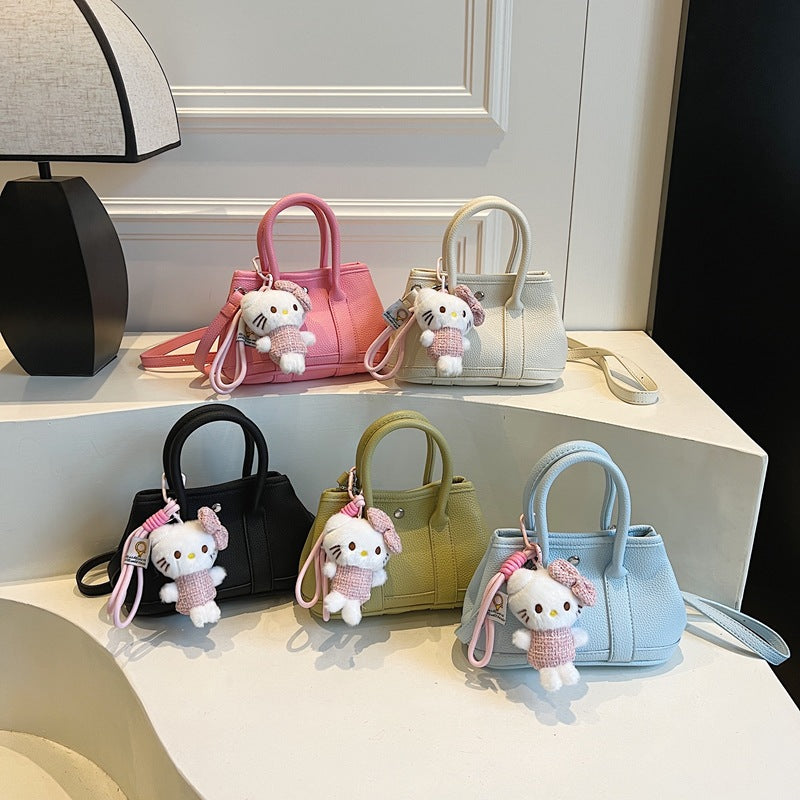 Ladies Mini Handbag with Playful Plush Pendant