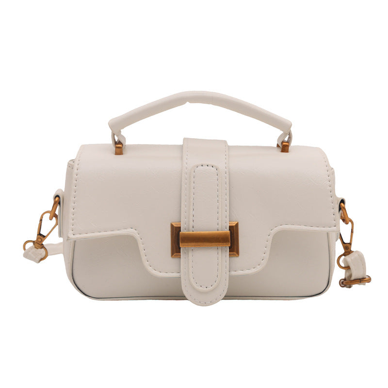 elegant mini handbag with practical carrying handle and removable shoulder strap