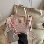 Women’s mini handbag in a charming design with removable pendant
