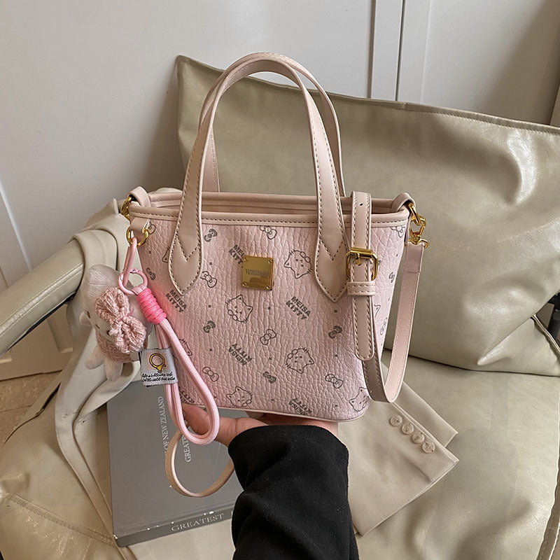 Women’s mini handbag in a charming design with removable pendant