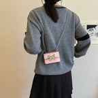 Mini Handbag with Shimmering Bow Closure