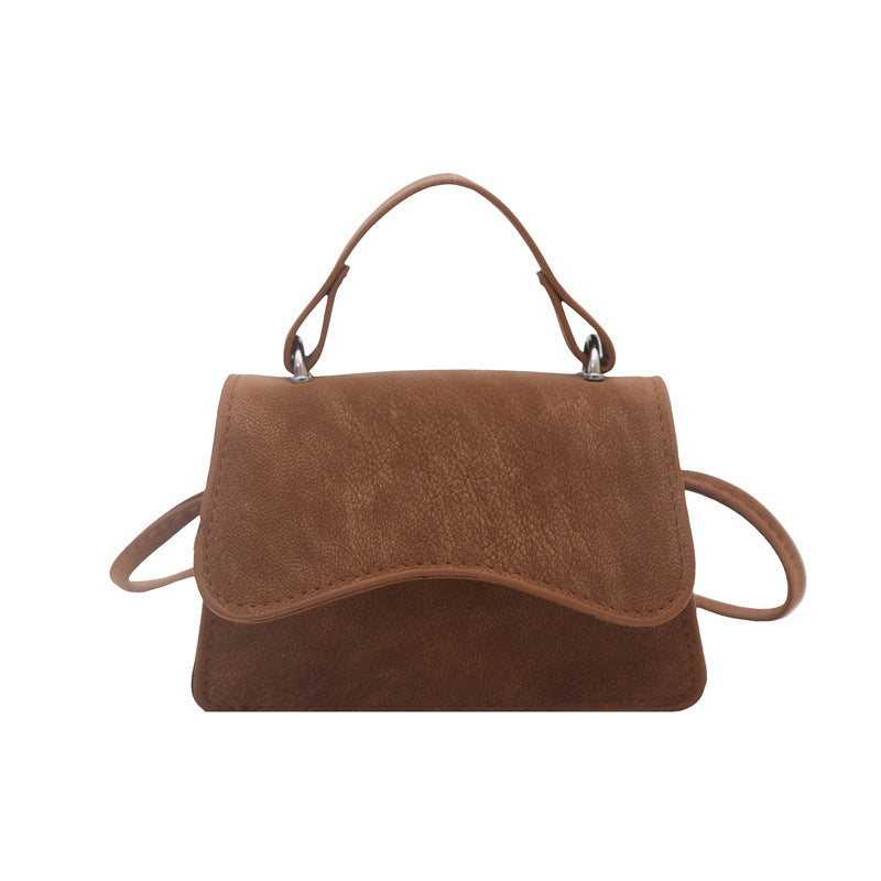 Ladies mini handbag with detachable carrying handle