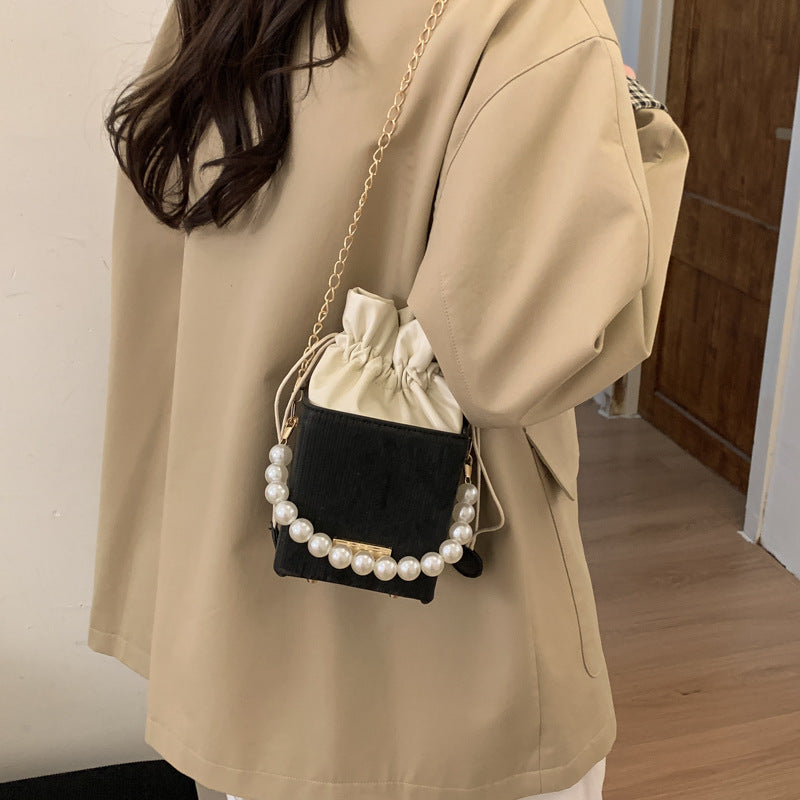 Women stylish mini handbag with drawstring and pearl accent Nord bags