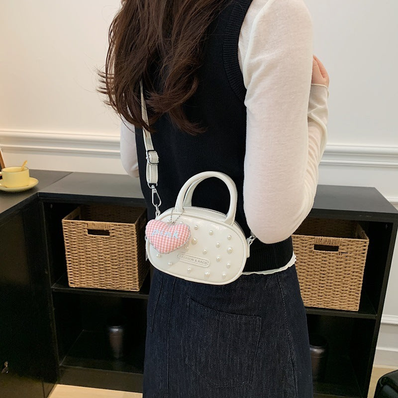 Ladies trendy mini handbag with striking pearl applications Nord bags