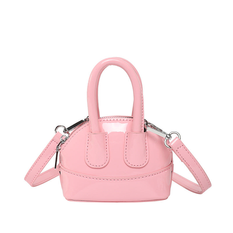 mini handbag with elegant glossy finish and removable shoulder strap