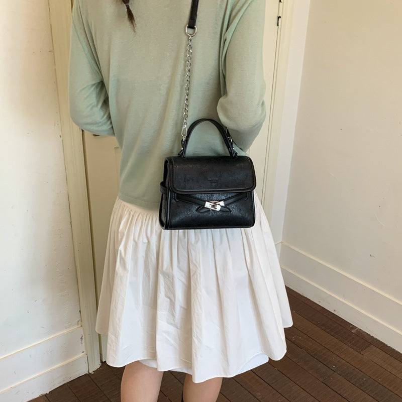 Women’s fashionable mini handbag with decorative magnetic closure