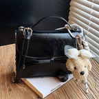 Ladies elegant mini handbag with cute pendant