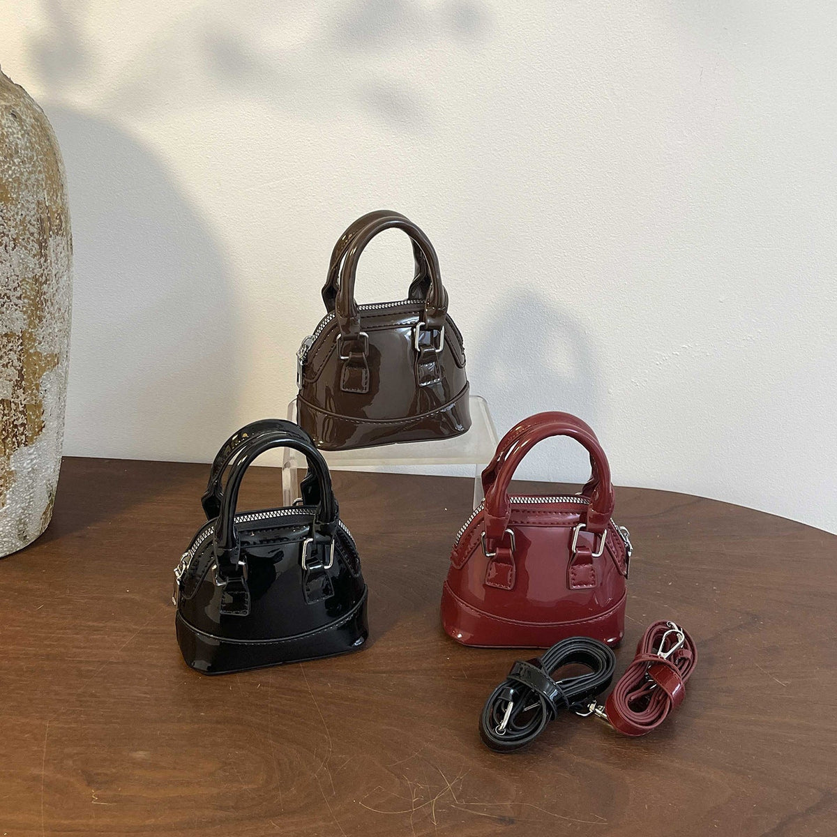 mini handbag with shiny surface and trendy zipper