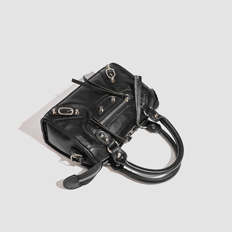 Ladies Mini handbag with decorative metal accents and detachable shoulder strap Nord Bags