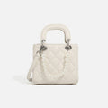 Women’s mini handbag with pearl-embellished chain and quilted design