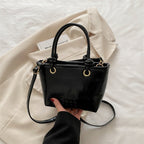elegant mini handbag with textured design and detachable shoulder strap