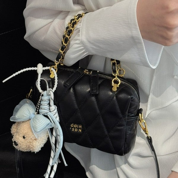 stylish mini handbag with playful animal pendant