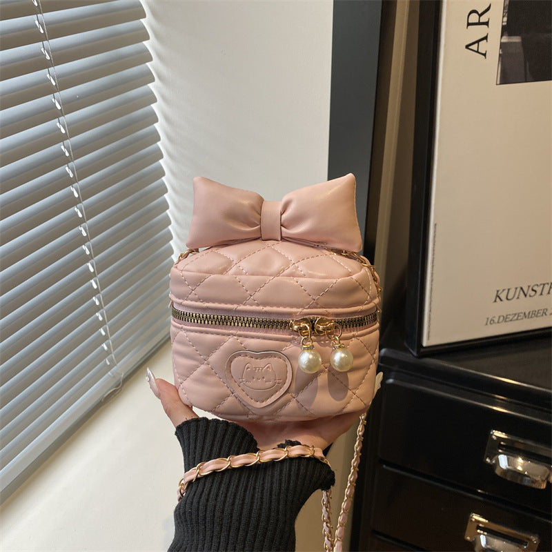 quilted mini handbag with stylish pearl accents
