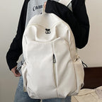 Backpack with Versatile Compartments and Charming Pendant