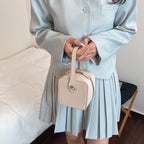 Women’s mini handbag with detachable shoulder strap and elegant flap closure