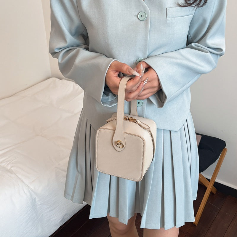 Women’s mini handbag with detachable shoulder strap and elegant flap closure