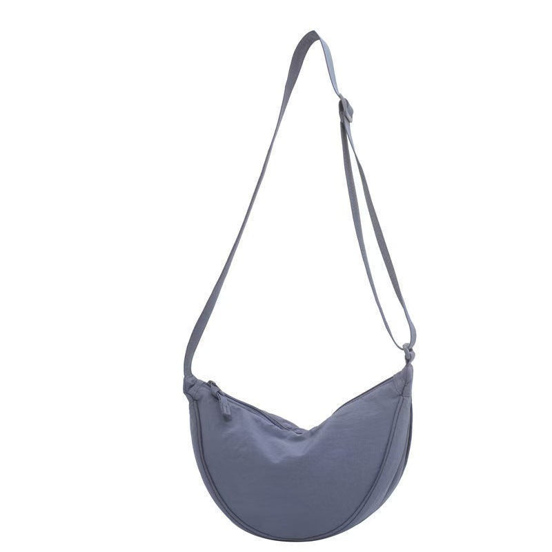 Shoulder bag with practical compartment system and adjustable shoulder strap