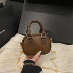 mini handbag with detachable chain and elegant design