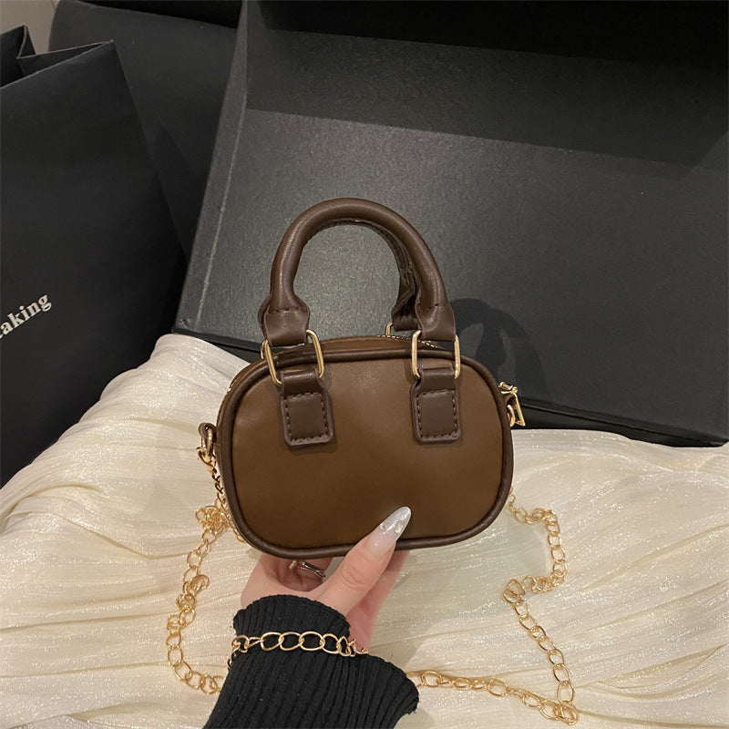 mini handbag with detachable chain and elegant design