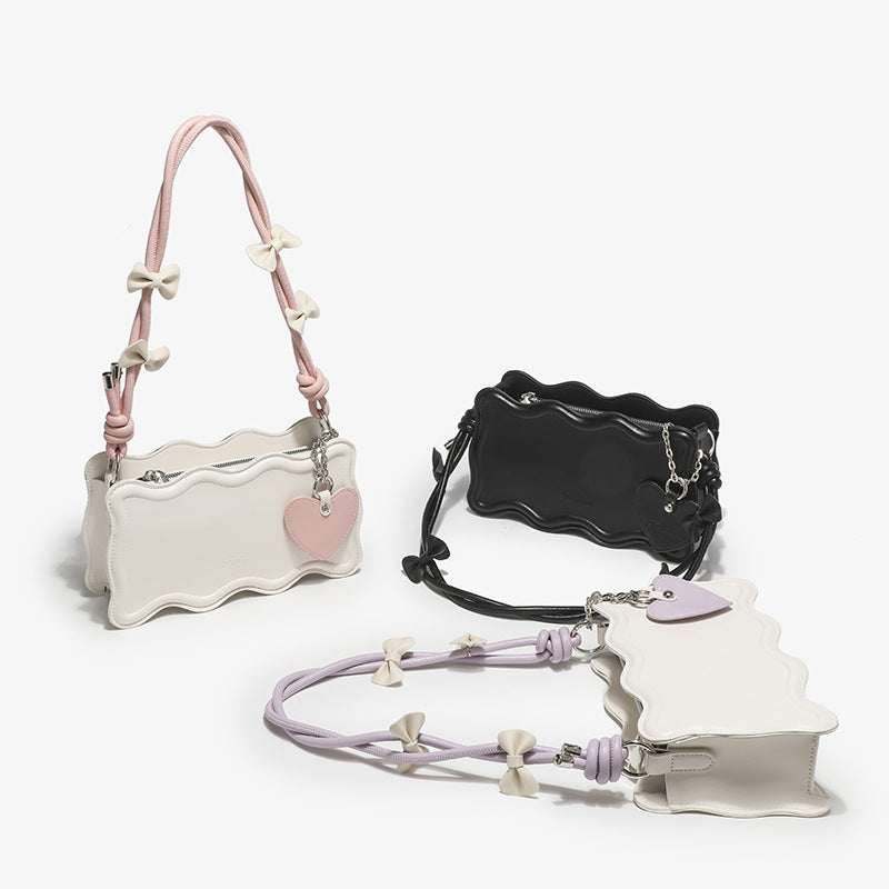 mini handbag with creative wave pattern and playful pendant