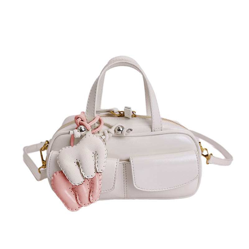 playful mini handbag with charming animal charm