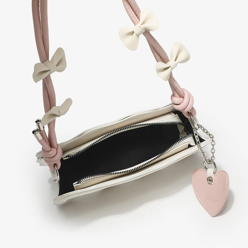 mini handbag with creative wave pattern and playful pendant