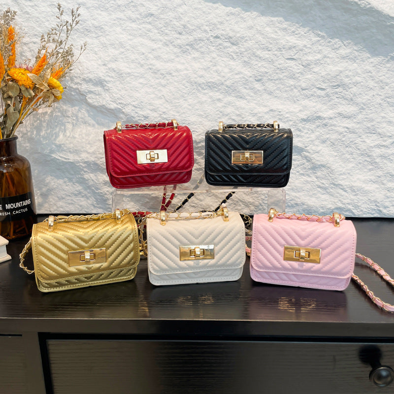 mini handbag with quilted design and golden closure