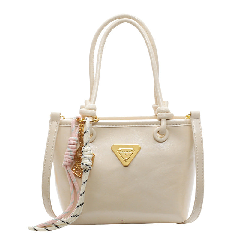 Mini handbag with elegant details and practical shoulder strap