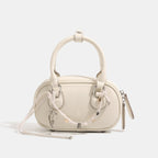 Ladies mini handbag with playful drawstring and elegant accents