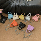 mini handbag with supple structure and detachable chain strap