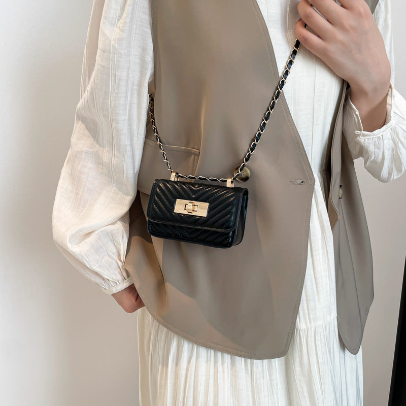 mini handbag with quilted design and golden closure