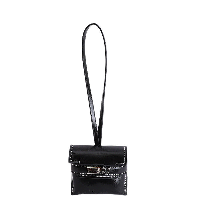 mini handbag made of high-quality synthetic leather with playful closure