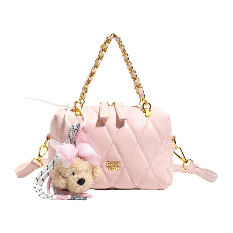 stylish mini handbag with playful animal pendant