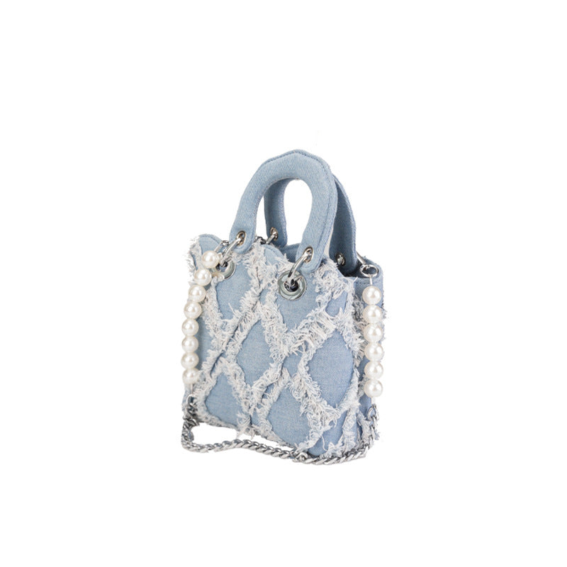 mini handbag with striking cinched design and pearl accents