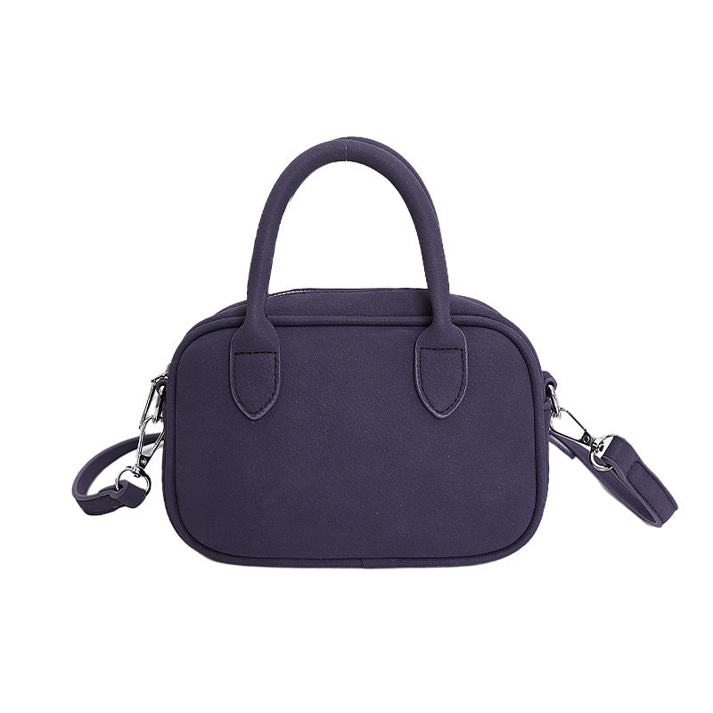 mini handbag with detachable shoulder strap and elegant design