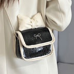 Women’s mini handbag with playful bow detail