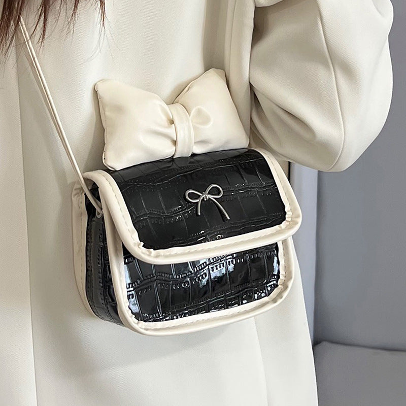 Women’s mini handbag with playful bow detail