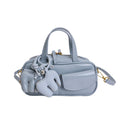 playful mini handbag with charming animal charm