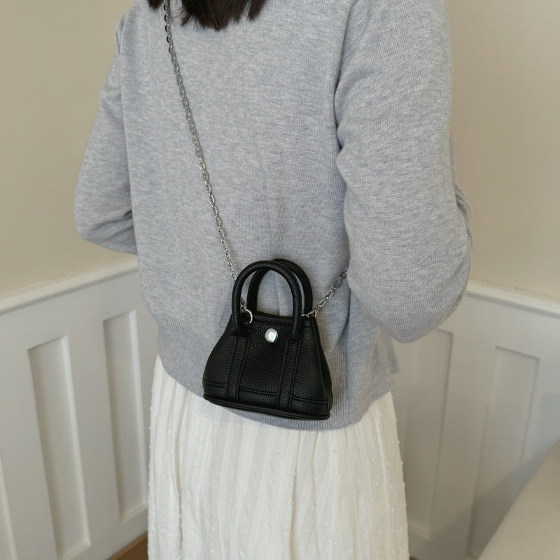 mini handbag with supple structure and detachable chain strap
