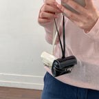 mini handbag made of high-quality synthetic leather with playful closure