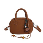 mini handbag with detachable shoulder strap and elegant design