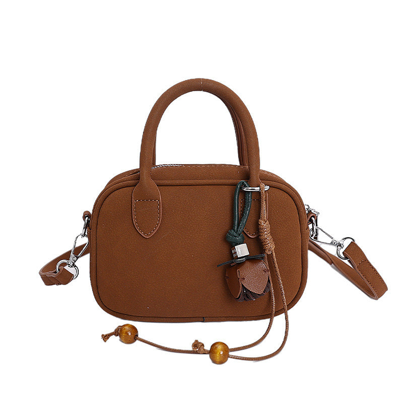 mini handbag with detachable shoulder strap and elegant design