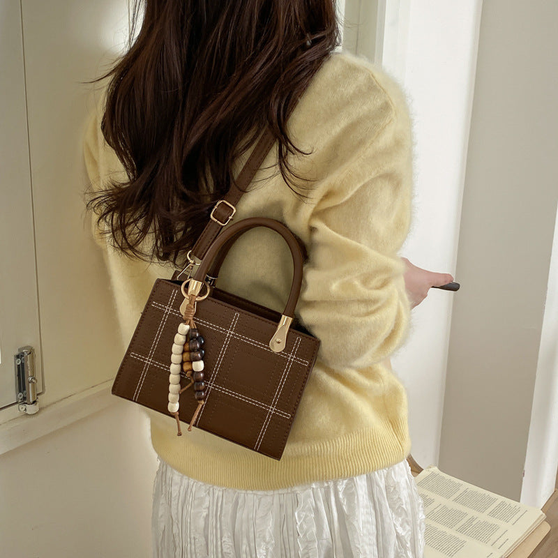 Mini Handbag with Elegant Structure and Golden Accents