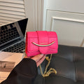 mini handbag with modern crocodile embossing and chic magnetic closure