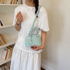 Ladies mini handbag with playful polka dot pattern and removable shoulder strap